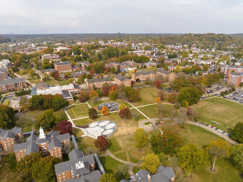 Aerial view of Ohio University’s Paw Print Park, surrounded by brick buildings and trees.