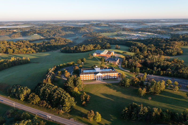 Aerial view of Ohio University’s Eastern campus, surrounded by rolling hills and trees.