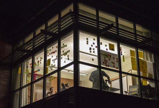 Innovation Center at night with post it notes on the windows